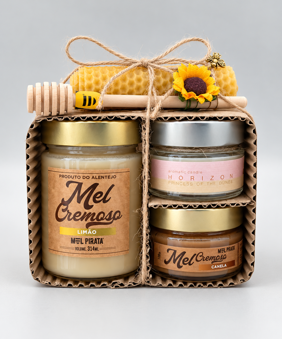 Kit Héstia com méis cremosos, velas e colher de madeira.